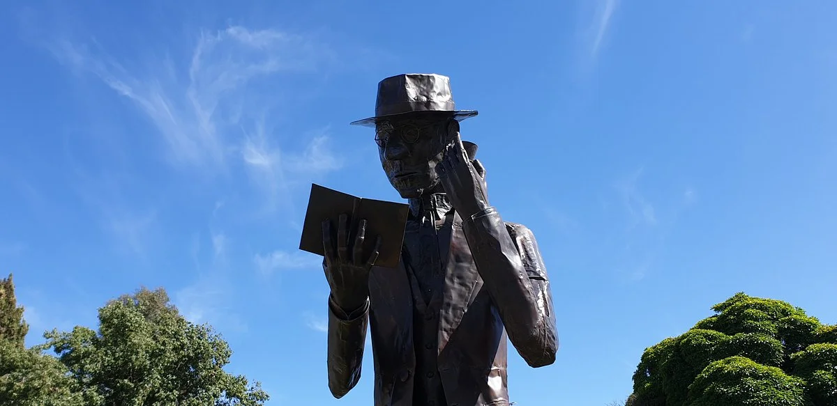 CJ Dennis Statue